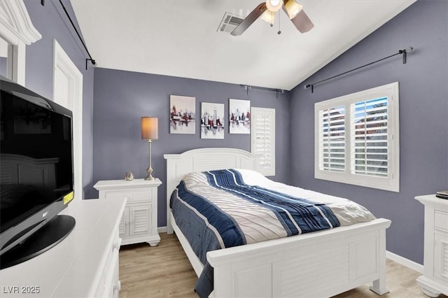 bedroom with lofted ceiling, light wood finished floors, ceiling fan, and visible vents