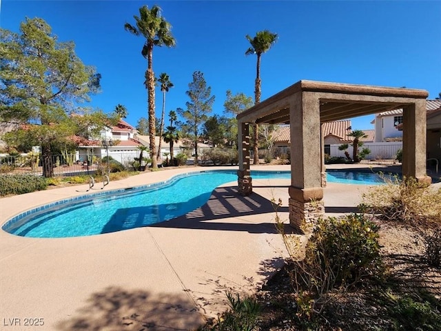 view of pool featuring fence, a fenced in pool, and a patio