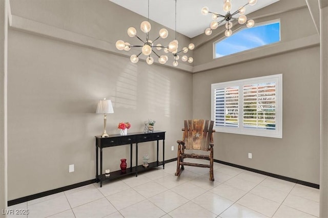 living area with a chandelier, baseboards, and a healthy amount of sunlight