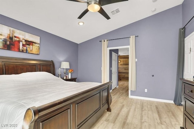 bedroom with visible vents, light wood-style flooring, a ceiling fan, vaulted ceiling, and baseboards