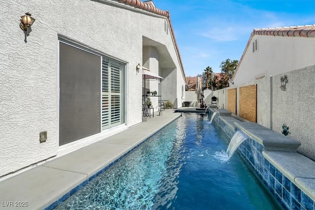 view of pool with fence