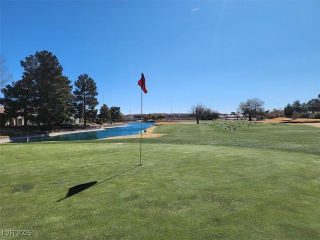 surrounding community featuring a water view and a yard