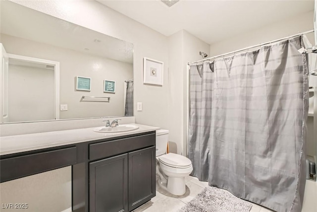 bathroom featuring toilet, tile patterned floors, vanity, and shower / bathtub combination with curtain