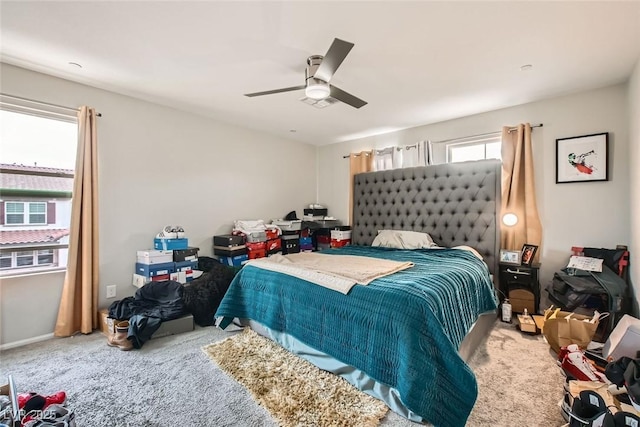 carpeted bedroom with a ceiling fan