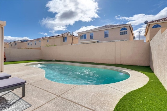 view of swimming pool with a fenced backyard, a fenced in pool, and a patio