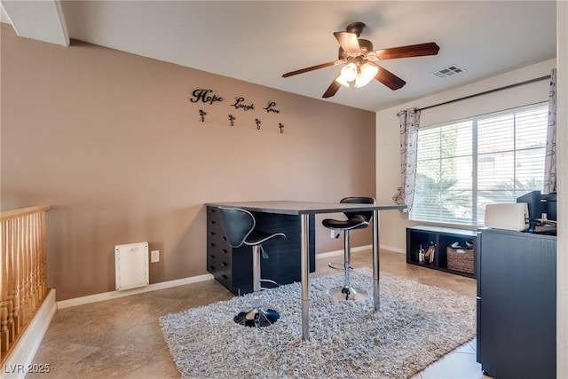 tiled home office featuring baseboards, visible vents, and ceiling fan