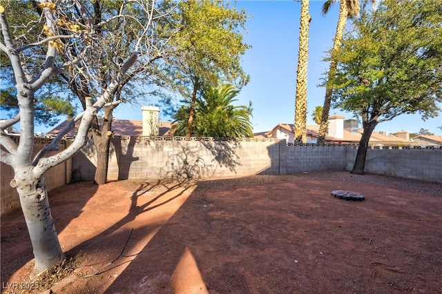 view of yard with a fenced backyard