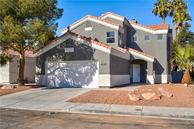 view of front of home with a chimney, stucco siding, an attached garage, driveway, and a tiled roof