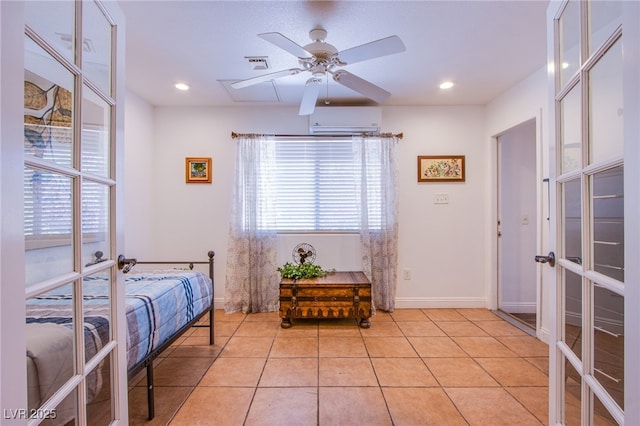 bedroom featuring light tile patterned floors, recessed lighting, visible vents, french doors, and a wall mounted AC