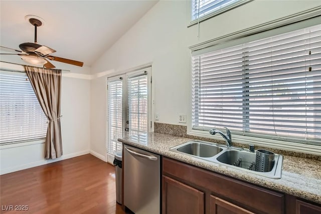 kitchen with lofted ceiling, dark wood-type flooring, a sink, ceiling fan, and dishwasher