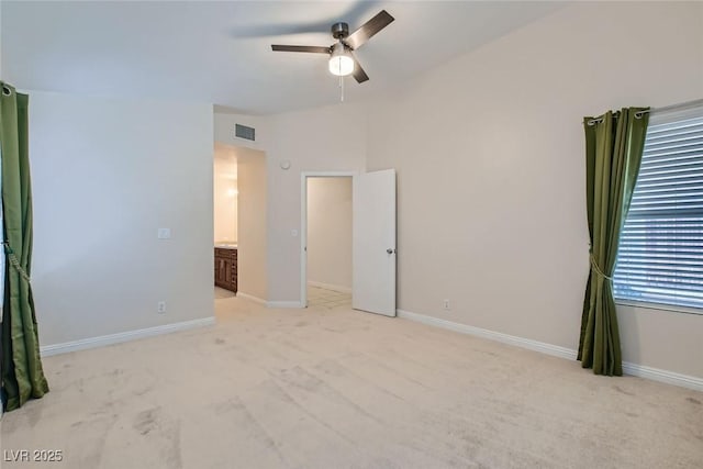 unfurnished bedroom featuring light carpet, ceiling fan, visible vents, and baseboards