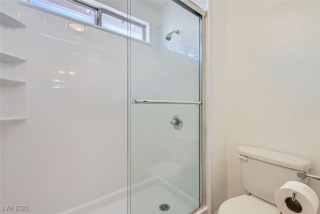 full bath with a shower stall and toilet