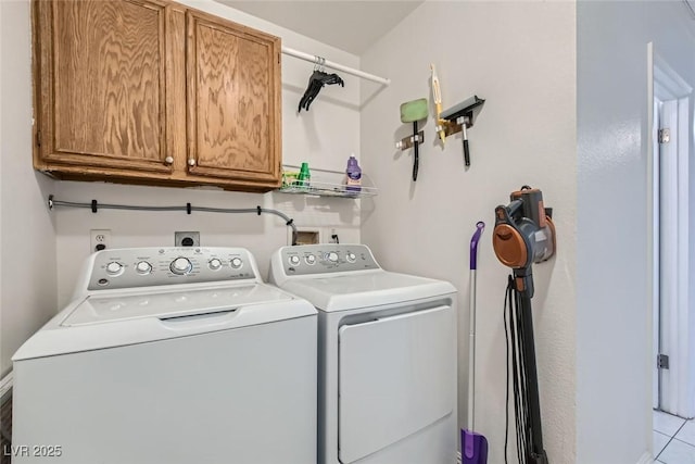 laundry area with cabinet space and washing machine and dryer