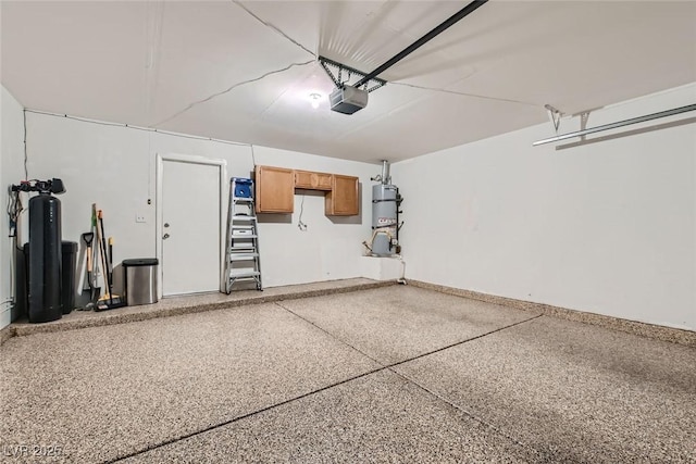 garage featuring secured water heater and baseboards