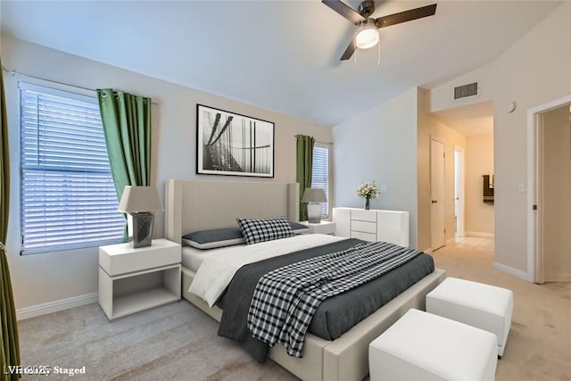 carpeted bedroom featuring vaulted ceiling, ceiling fan, visible vents, and baseboards