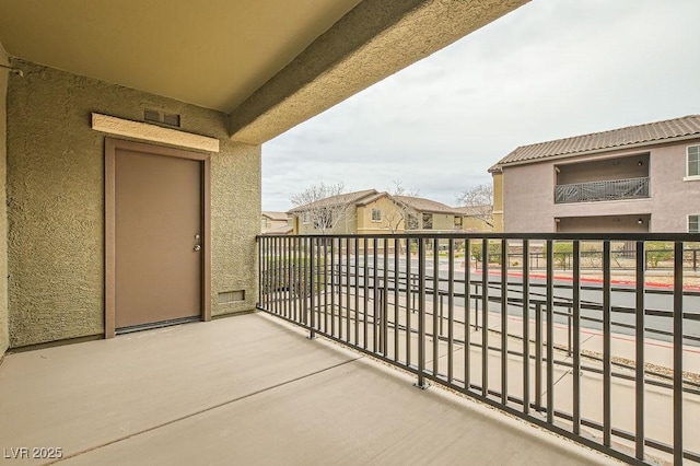 balcony with a residential view and visible vents