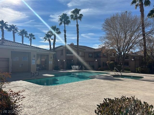 community pool with a patio