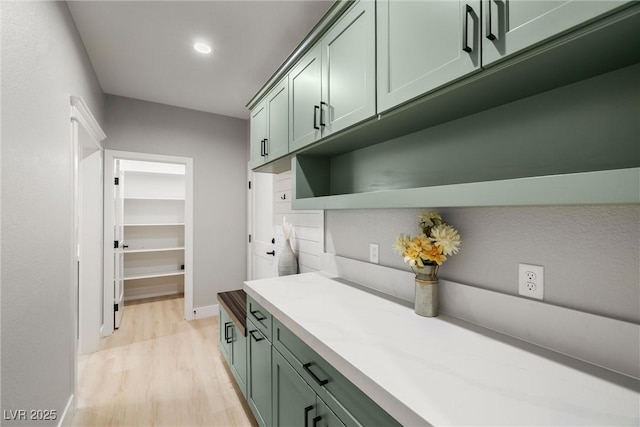 bar with recessed lighting, light wood-type flooring, and baseboards