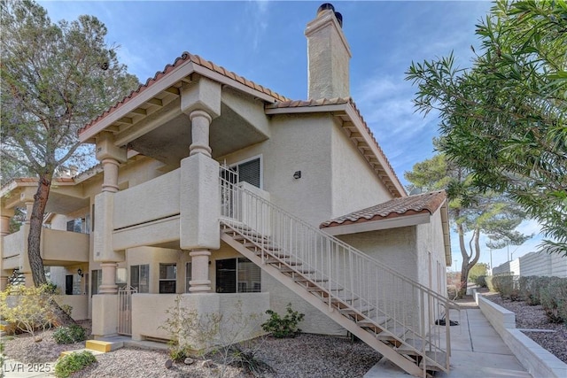 view of property featuring stairway