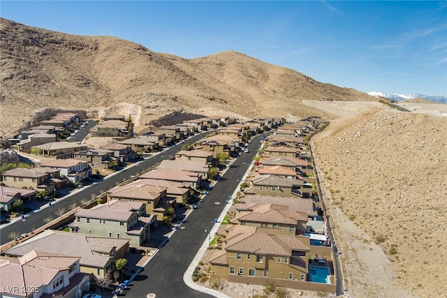 drone / aerial view with a residential view and a mountain view