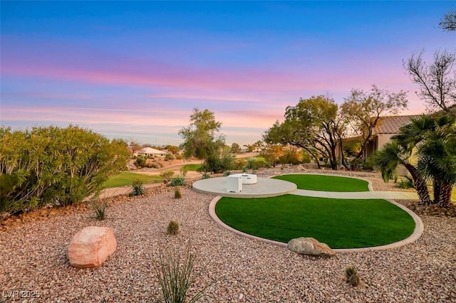 view of property's community featuring a yard