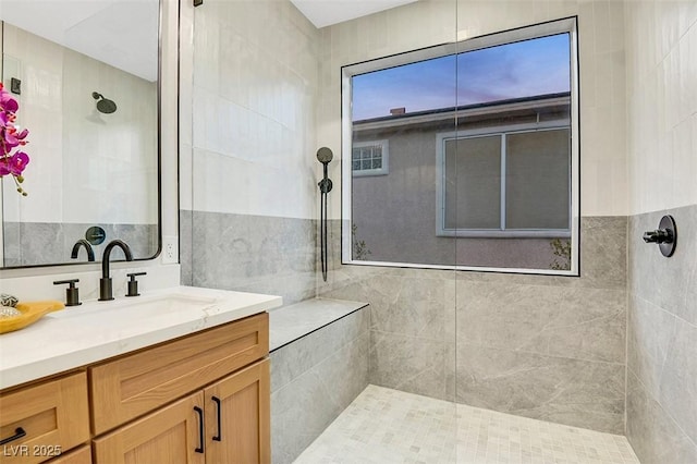 full bath with walk in shower and vanity