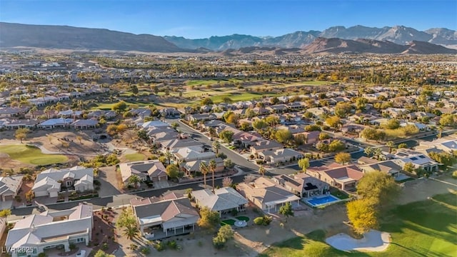 drone / aerial view featuring a residential view and a mountain view