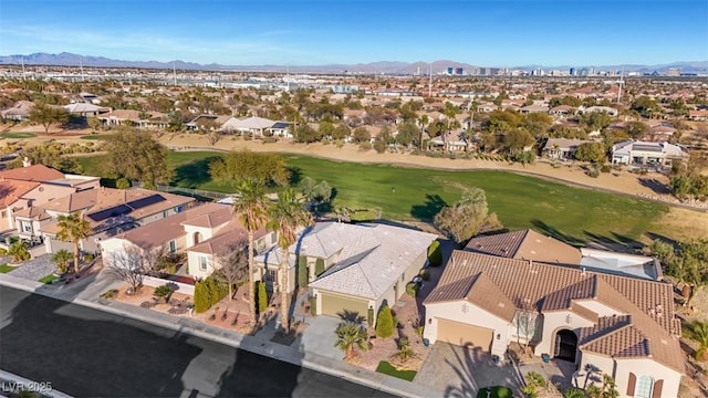 birds eye view of property with a residential view, a mountain view, and golf course view