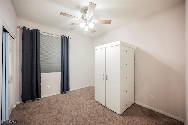 unfurnished bedroom featuring light carpet, visible vents, and baseboards