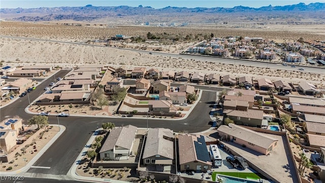 bird's eye view with a residential view and a mountain view