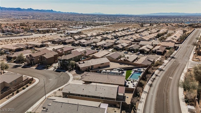 drone / aerial view featuring a residential view and a mountain view