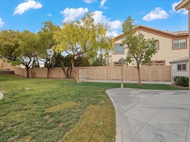 view of yard with a fenced backyard and a patio