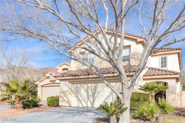 view of front of house with driveway, a tile roof, a garage, and stucco siding