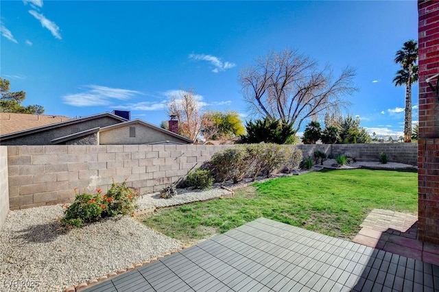 view of yard with a fenced backyard