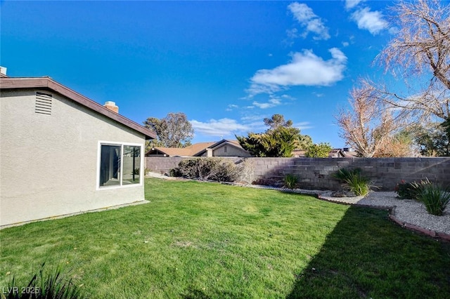 view of yard with a fenced backyard