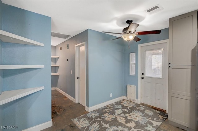 entrance foyer featuring baseboards, visible vents, and a ceiling fan