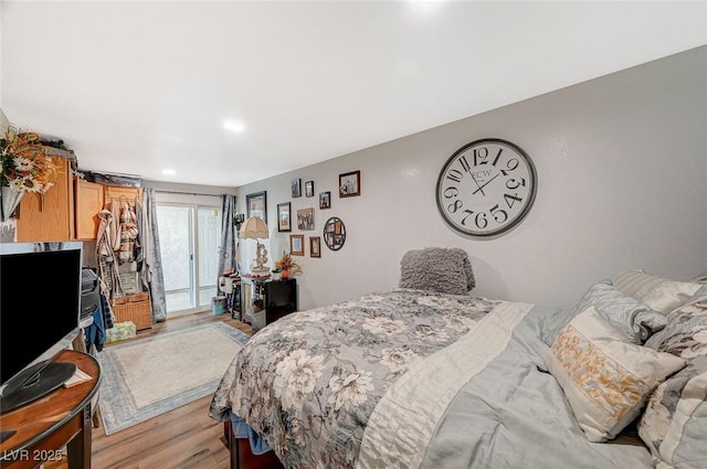 bedroom featuring access to outside and light wood-type flooring