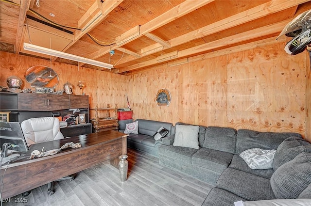 office area featuring wood walls and wood finished floors