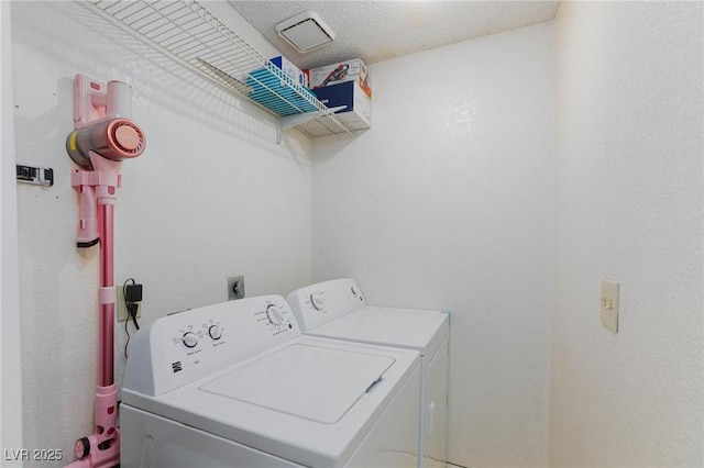 laundry area featuring laundry area and washer and dryer