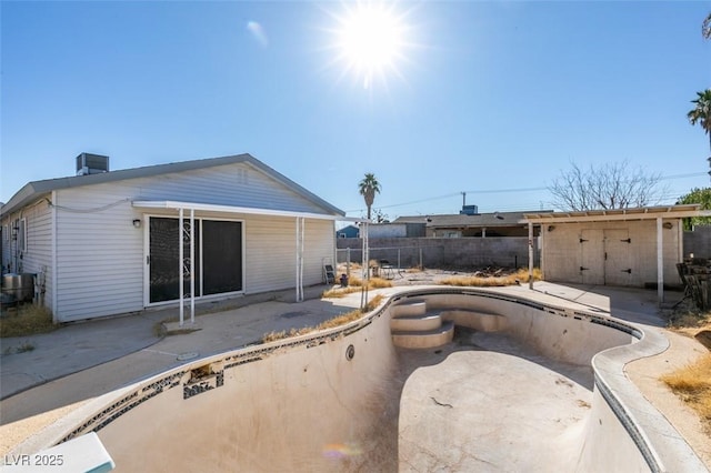 exterior space featuring a patio, central AC, and fence