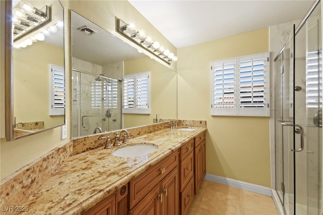 full bath with double vanity, a stall shower, visible vents, and a sink