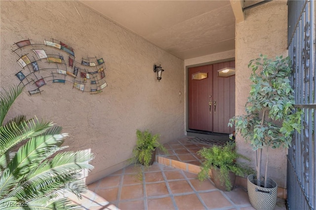 property entrance featuring stucco siding