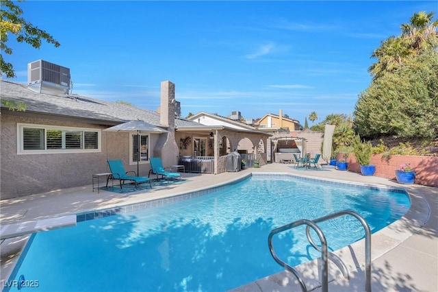 view of pool featuring a fenced in pool, fence, a patio, and central air condition unit