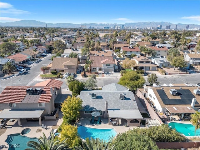 drone / aerial view with a residential view and a mountain view