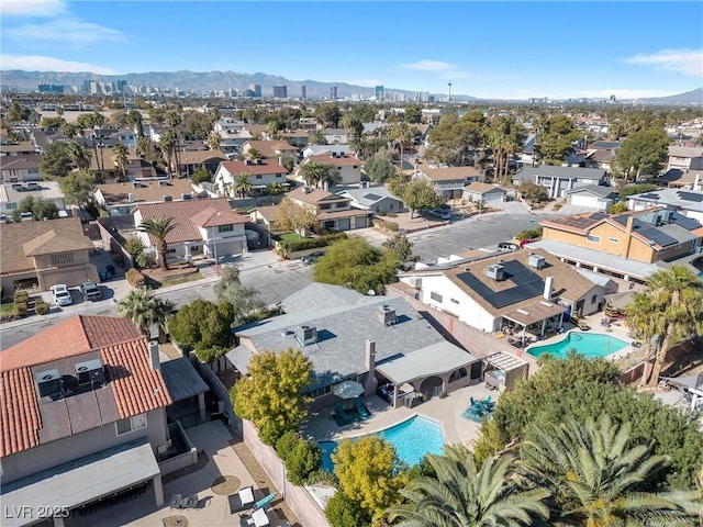 drone / aerial view featuring a residential view and a mountain view