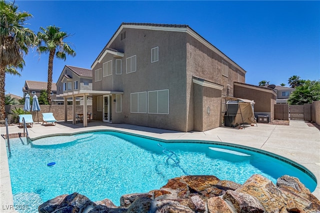 view of pool with a fenced backyard, a fenced in pool, and a patio