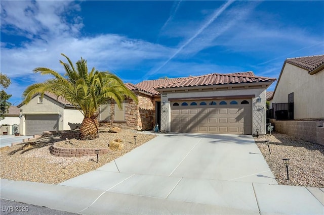 view of front of house with driveway, an attached garage, a tiled roof, and stucco siding