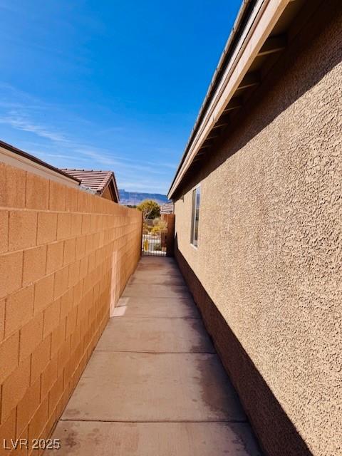 4562 White Cap Mill St, Las Vegas, NV 89147 - view of home's exterior featuring stucco siding and fence