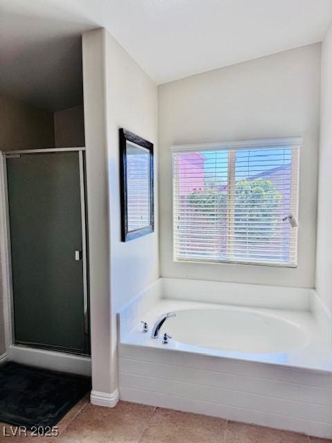 4562 White Cap Mill St, Las Vegas, NV 89147 - full bathroom featuring tile patterned floors, a shower stall, and a garden tub