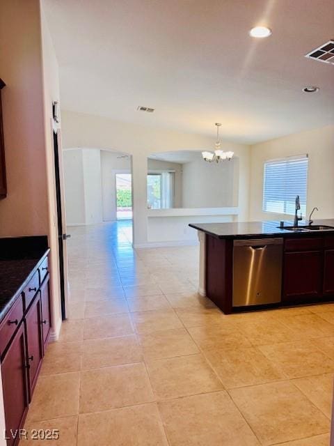 4562 White Cap Mill St, Las Vegas, NV 89147 - kitchen with stainless steel dishwasher, a sink, dark countertops, healthy amount of natural light, and recessed lighting